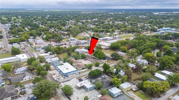 an aerial view of residential houses with city view