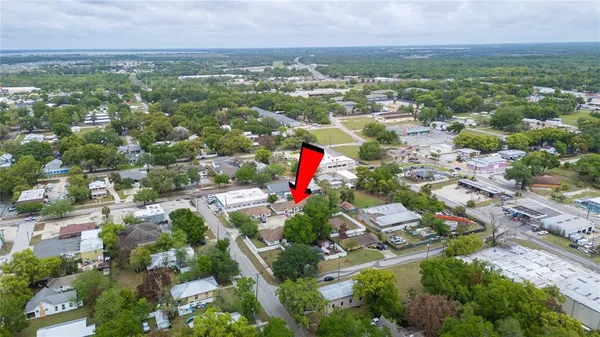 an aerial view of house with a yard