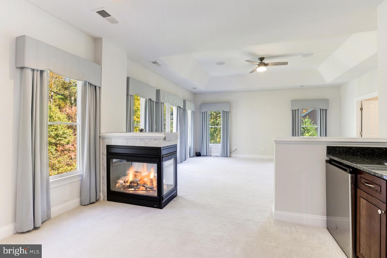 9600 Thistle Ridge Lane Vienna, VA 22182 - Photo 30 of 69 Owner's Suite Sitting Room - 3-sided Fireplace