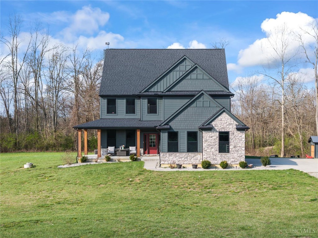 2425 Middleboro Road Clarksville, OH 45113 - Photo 9 of 91 This home features striking architectural details and a welcoming porch, perfect for outdoor relaxation.