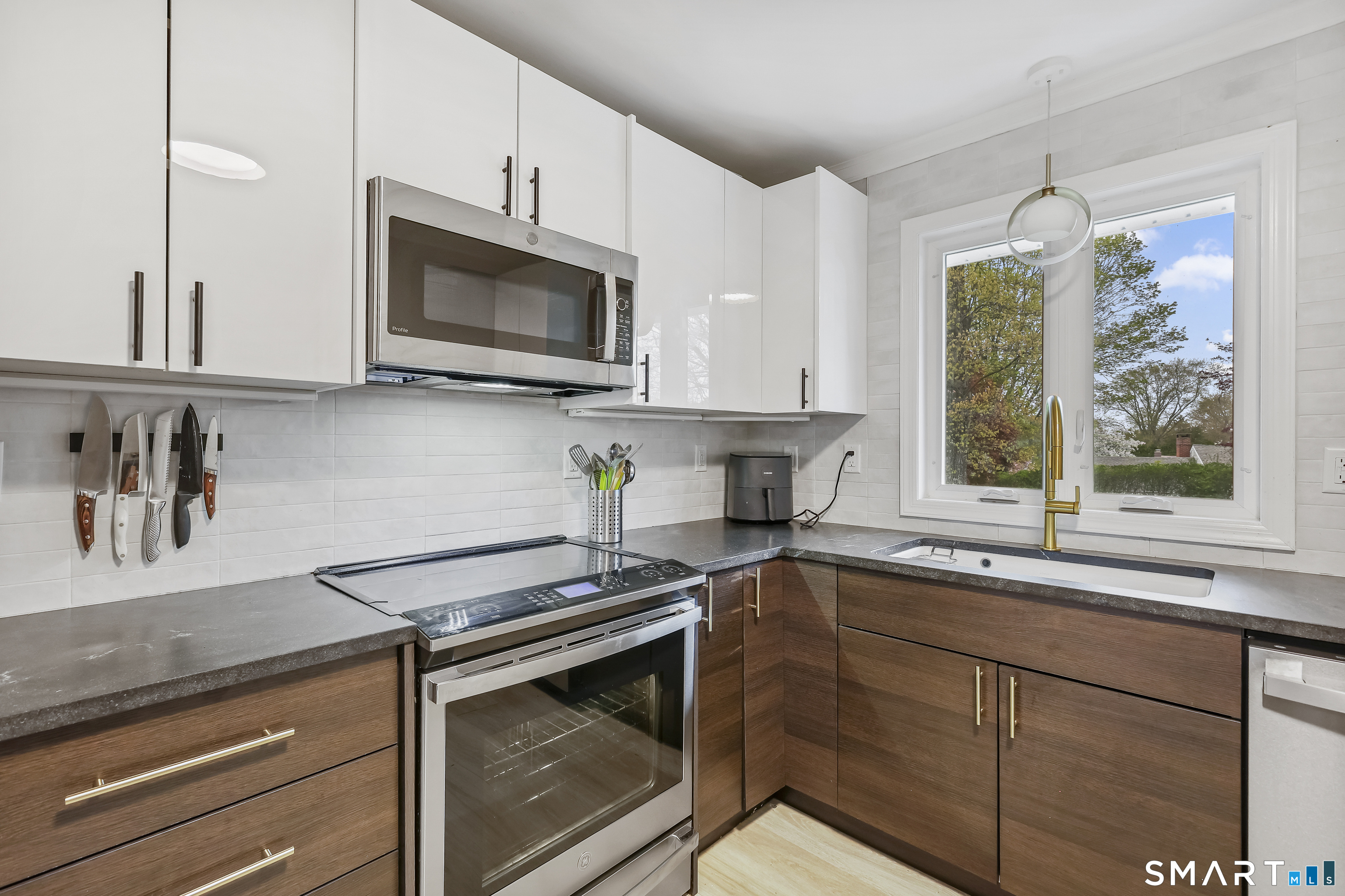 28 Kingston Road Trumbull, CT 06611 - Photo 18 of 38 Beautiful Granite Counters with top of the line appliances, Kohler porcelain work station sink, Kohler faucet, and an amazing induction stove.