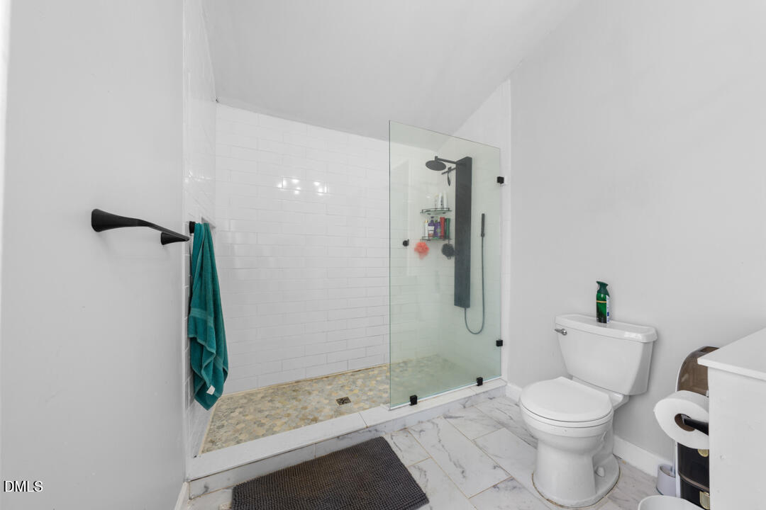 4739 Wild Azalea Place Rougemont, NC 27572 - Photo 23 of 48 a bathroom with a sink and toilet