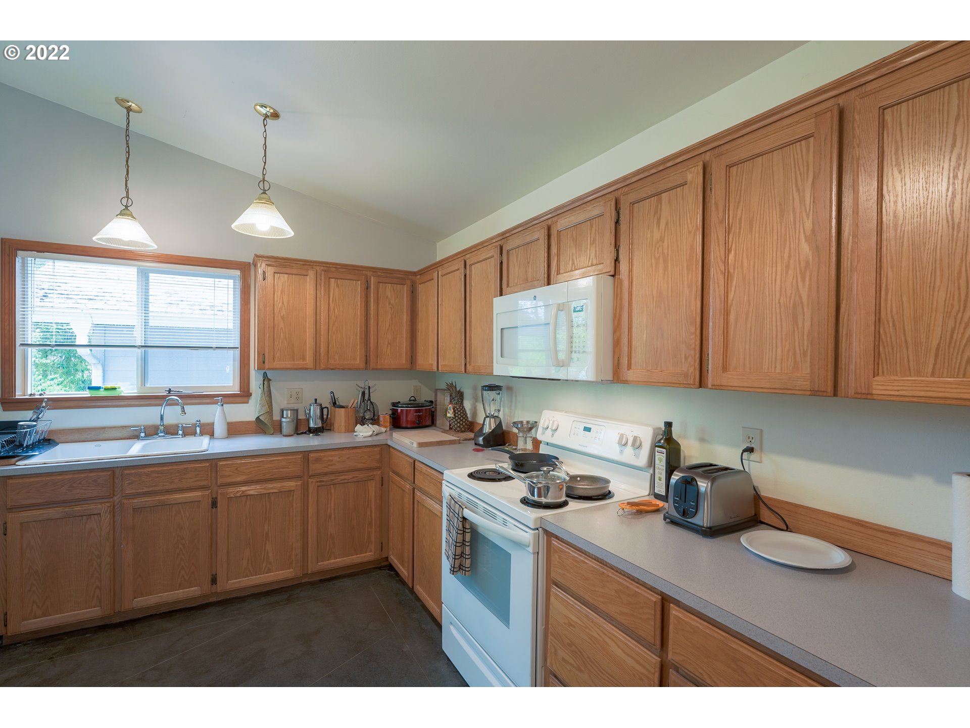 79774 Lower Nehalem Road Seaside, OR 97138 - Photo 11 of 32 a kitchen with a sink cabinets and window