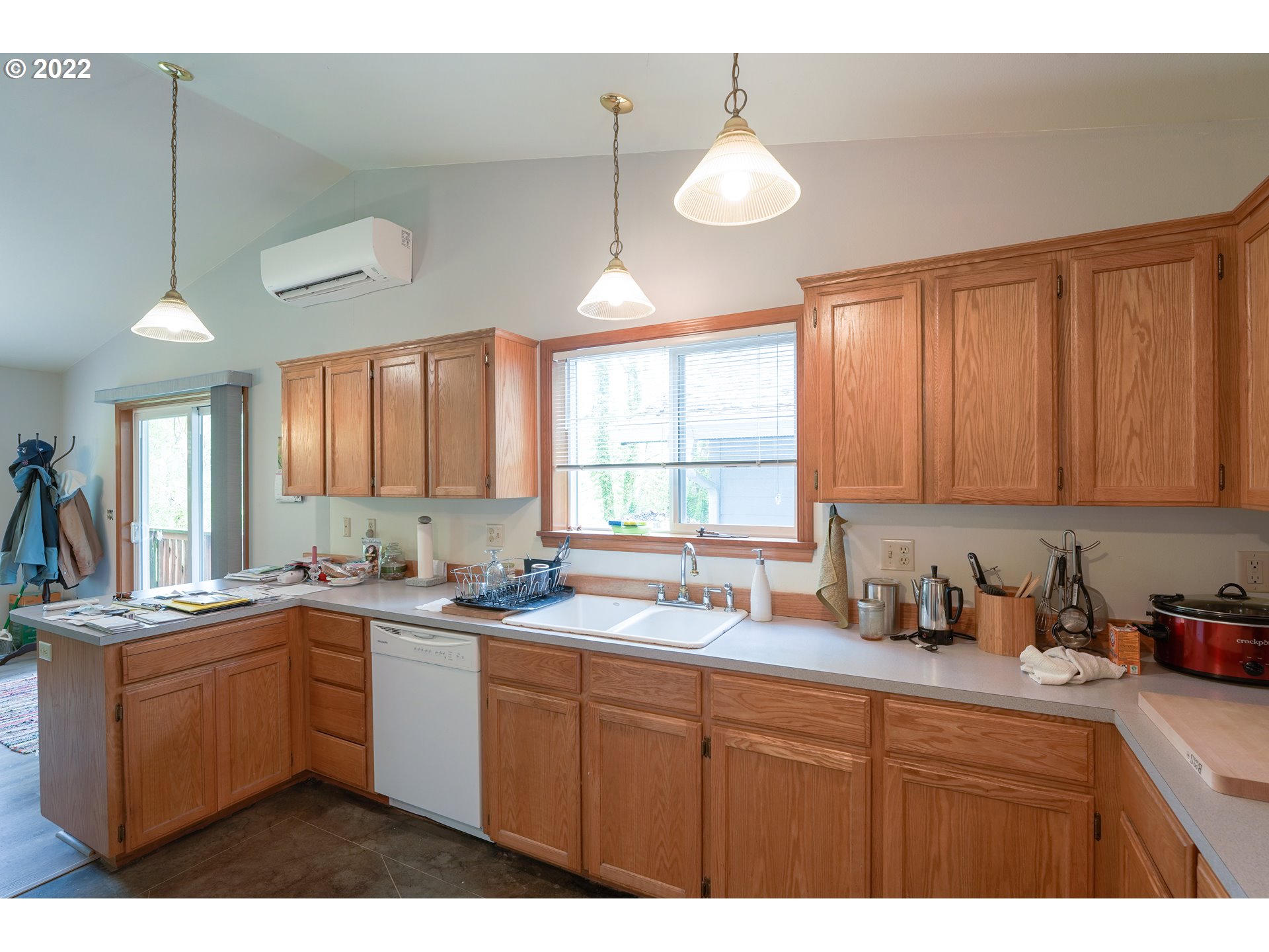 79774 Lower Nehalem Road Seaside, OR 97138 - Photo 12 of 32 a kitchen with a sink window and cabinets