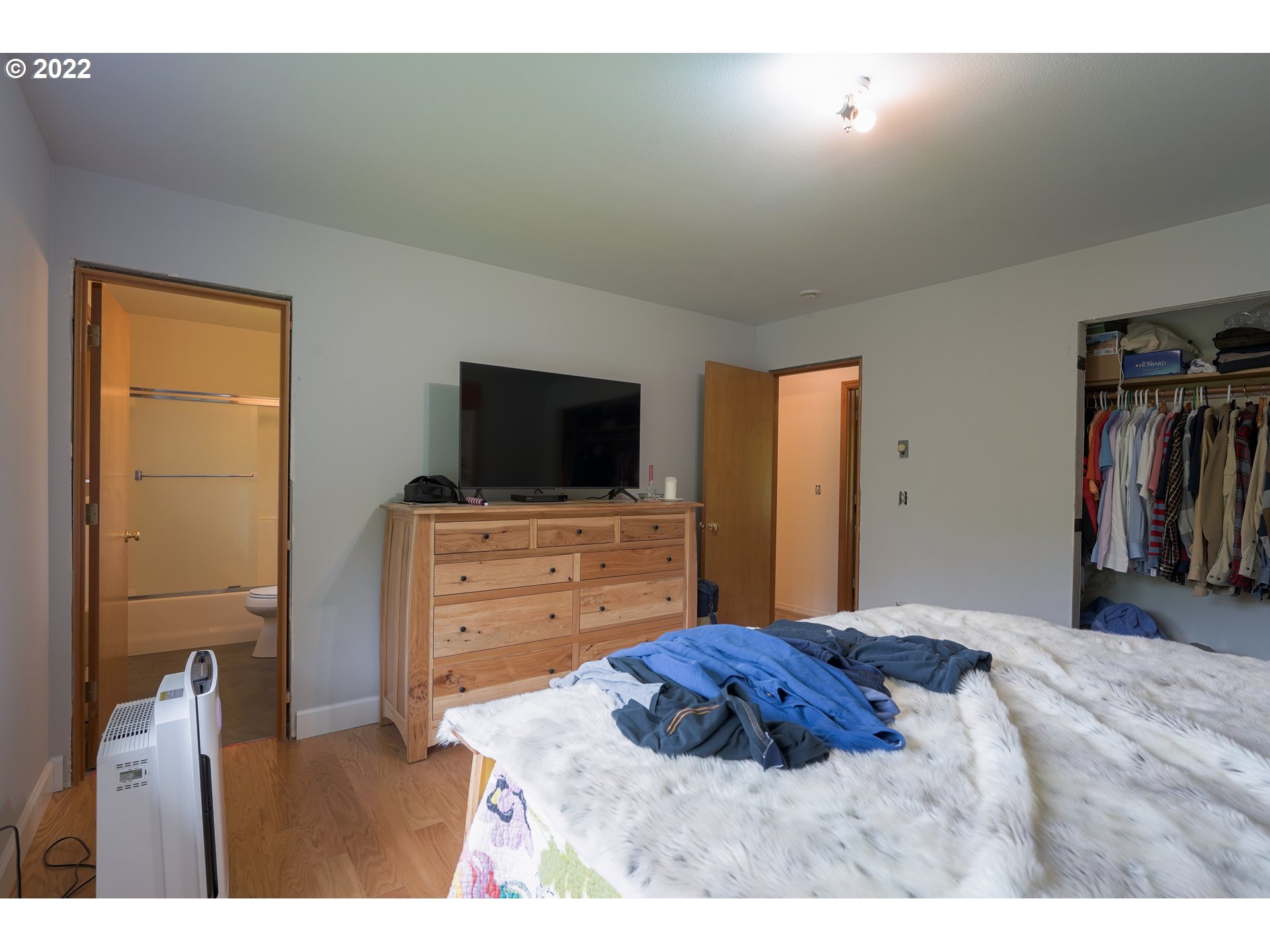 79774 Lower Nehalem Road Seaside, OR 97138 - Photo 16 of 32 a bedroom with a bed and a flat screen tv