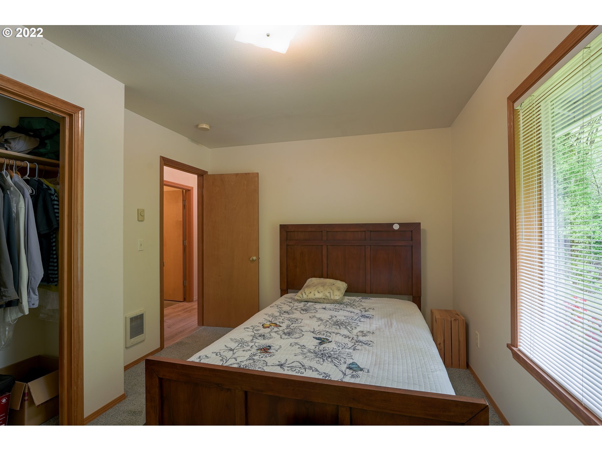 79774 Lower Nehalem Road Seaside, OR 97138 - Photo 18 of 32 a bedroom with a bed and a mirror