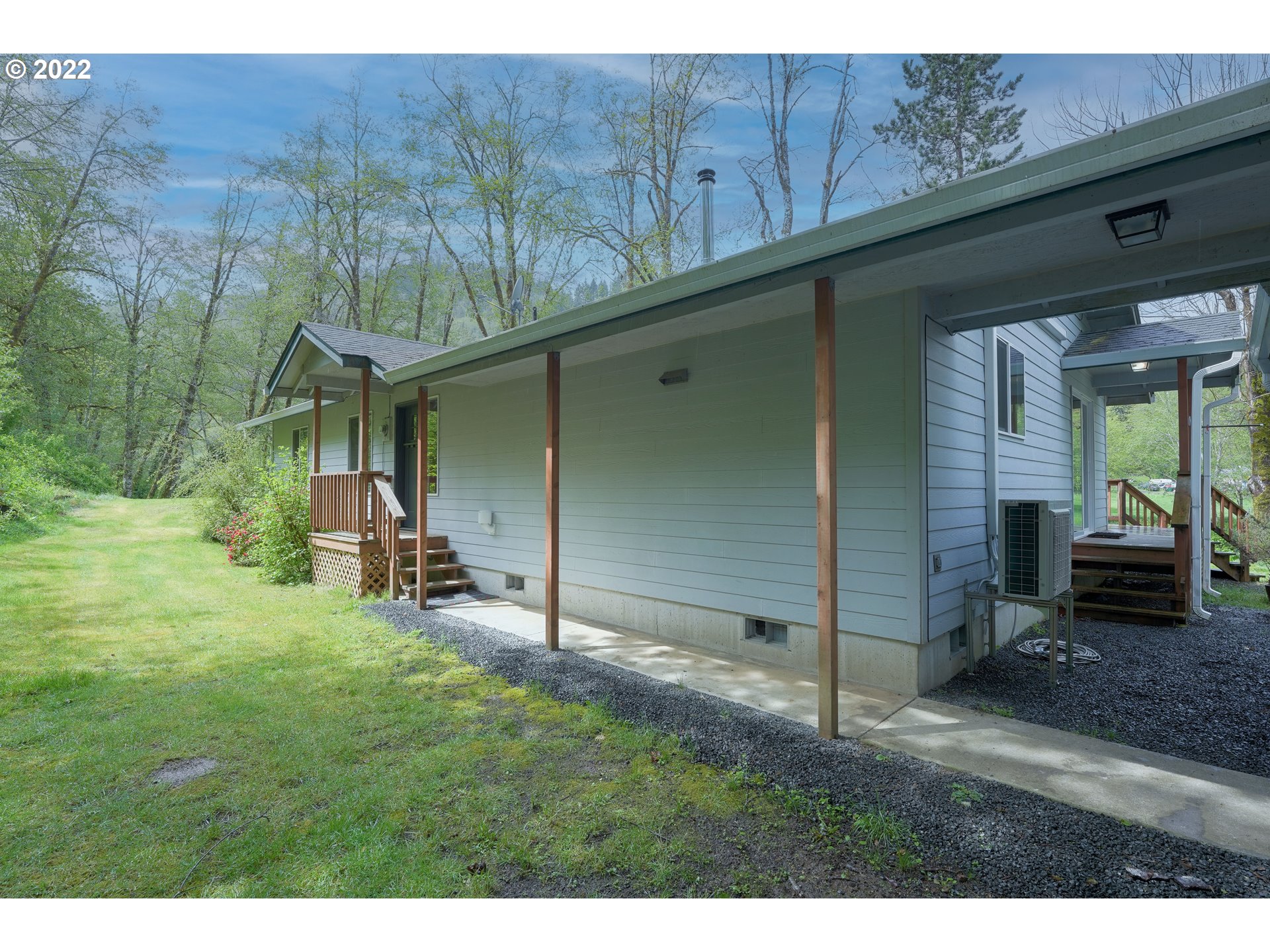 79774 Lower Nehalem Road Seaside, OR 97138 - Photo 20 of 32 a backyard of a house with table and chairs