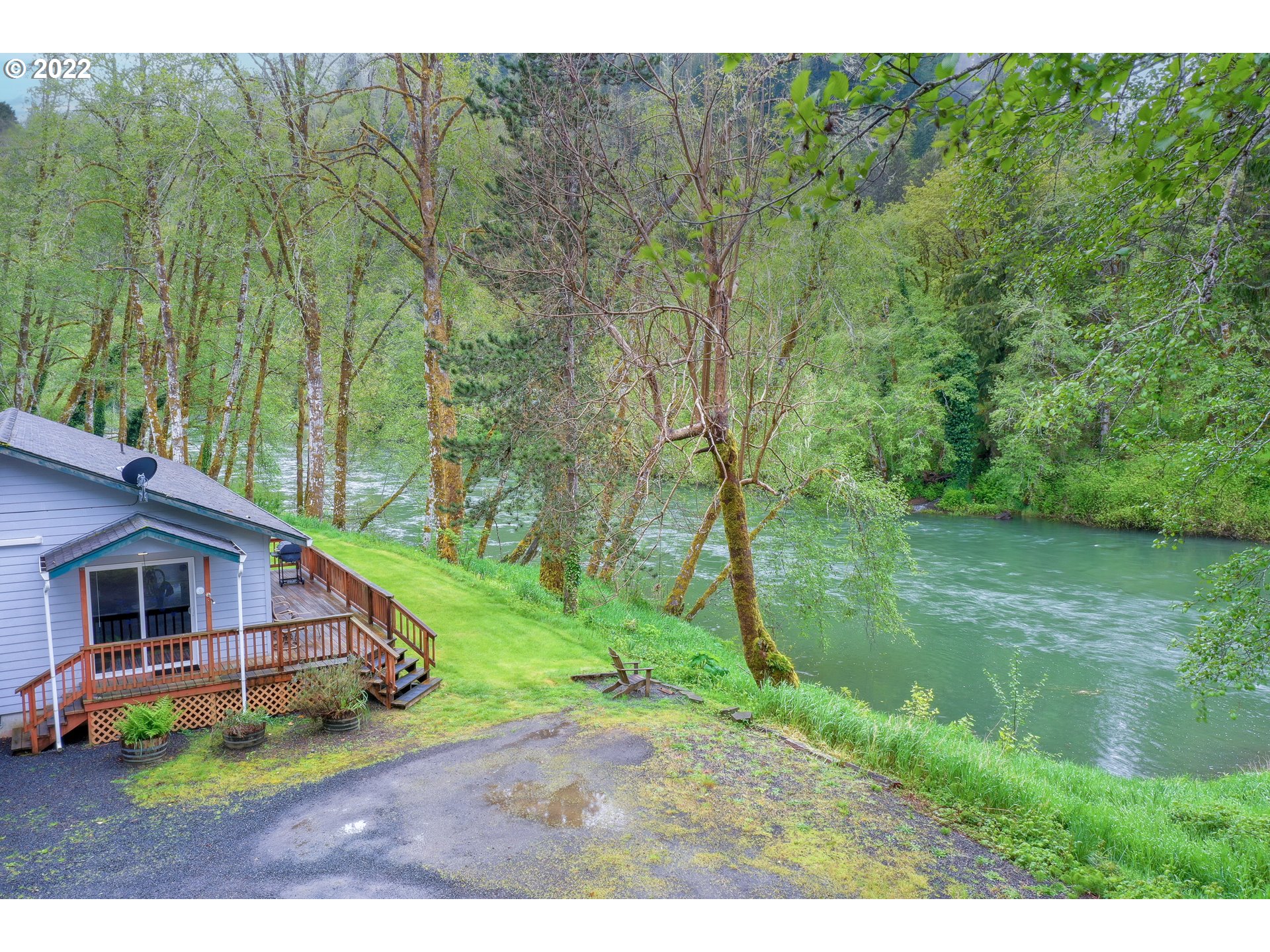 79774 Lower Nehalem Road Seaside, OR 97138 - Photo 21 of 32 a aerial view of a house next to a big yard and large trees