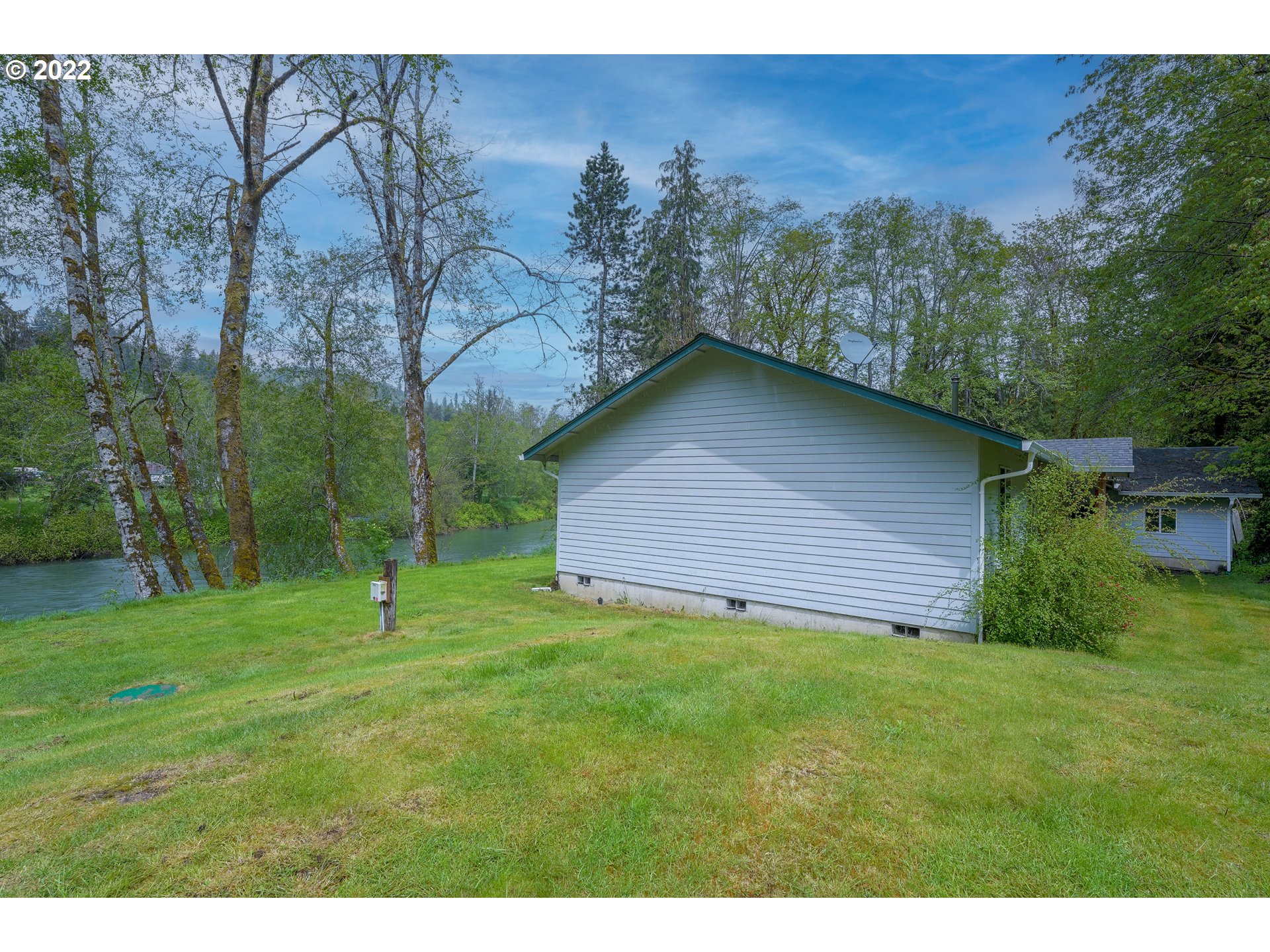 79774 Lower Nehalem Road Seaside, OR 97138 - Photo 22 of 32 a backyard of a house with lots of green space
