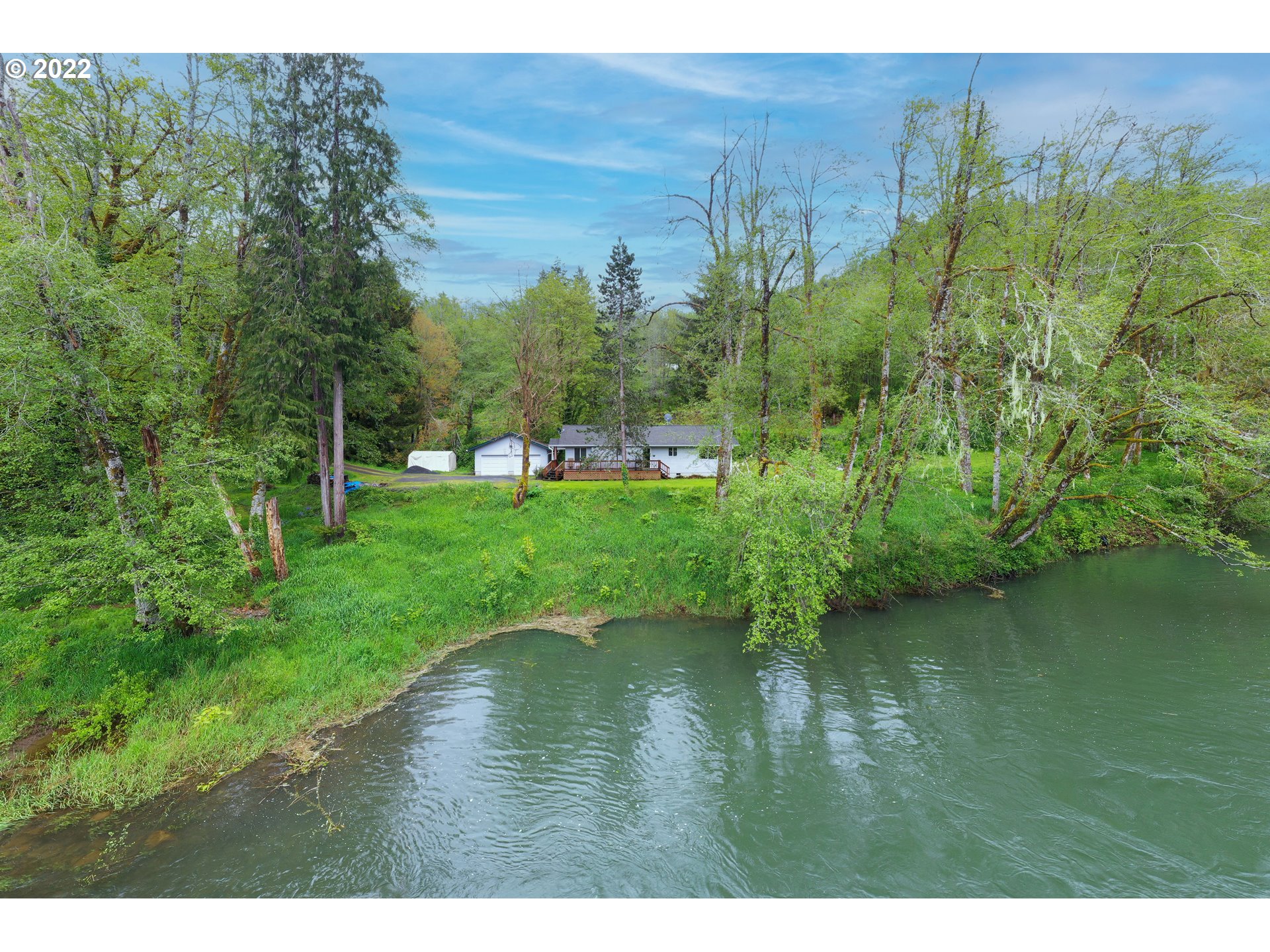 79774 Lower Nehalem Road Seaside, OR 97138 - Photo 27 of 32 a view of a water pond with green yard