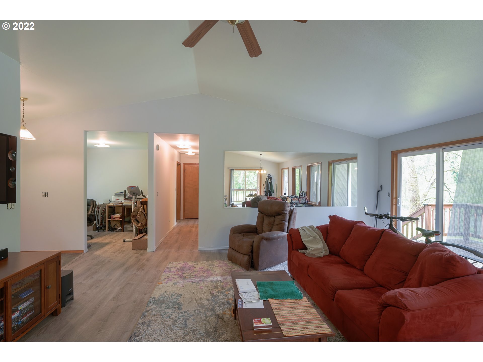 79774 Lower Nehalem Road Seaside, OR 97138 - Photo 8 of 32 a living room with furniture and a flat screen tv