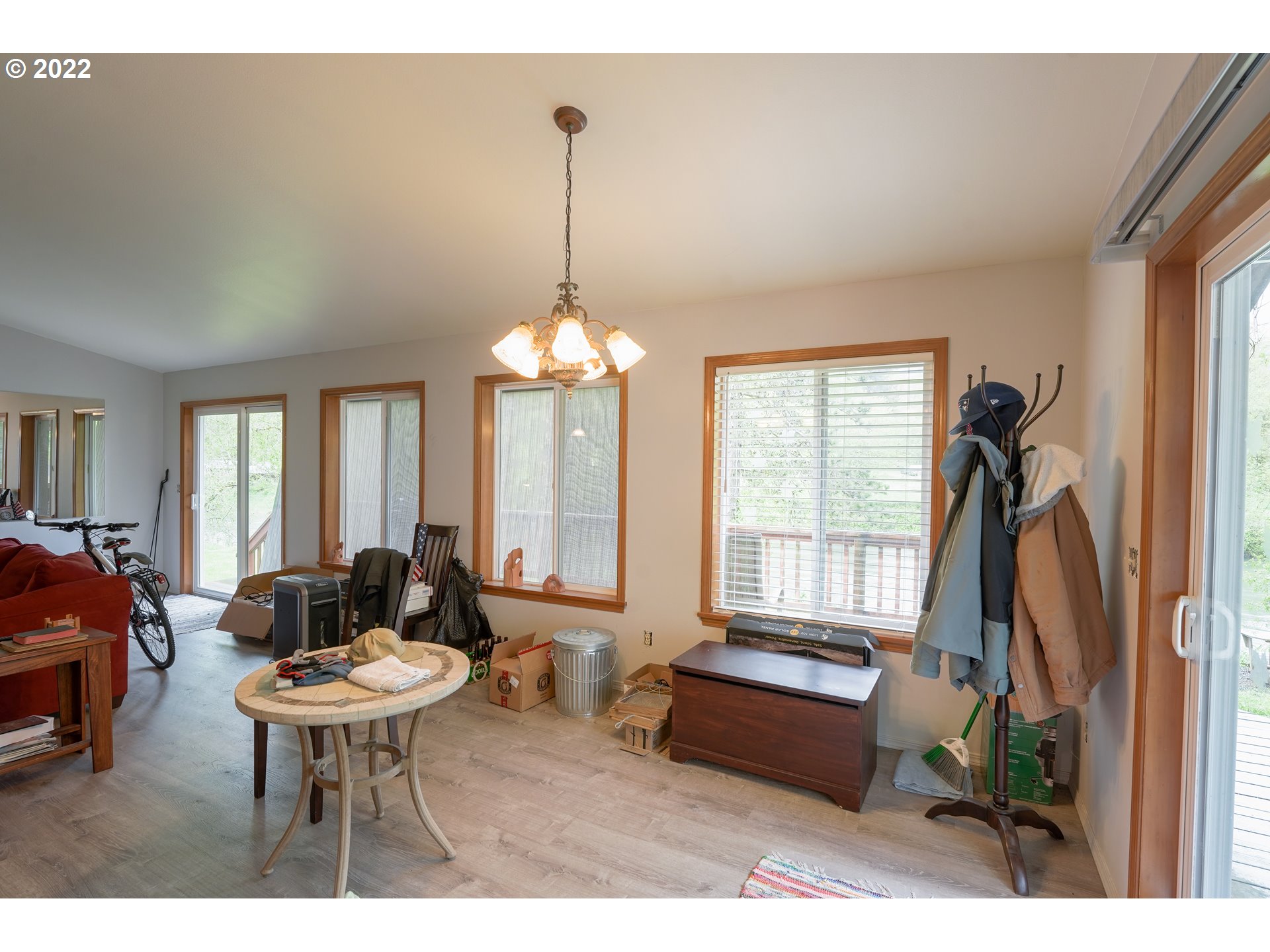 79774 Lower Nehalem Road Seaside, OR 97138 - Photo 9 of 32 a living room with furniture a window and a chandelier