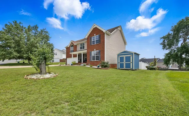 a front view of a house with a yard