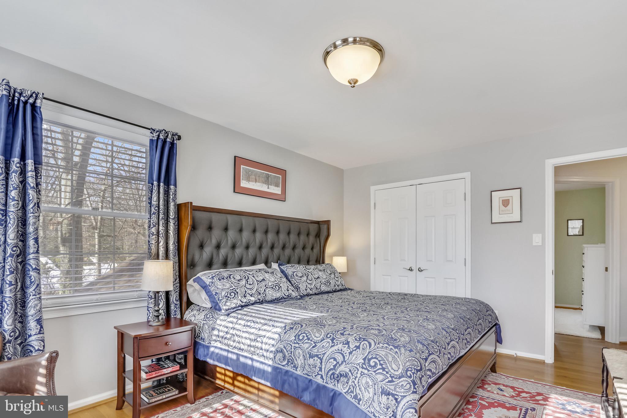 10783 Kinloch Road Silver Spring, MD 20903 - Photo 14 of 43 a bedroom with a bed and wooden floor