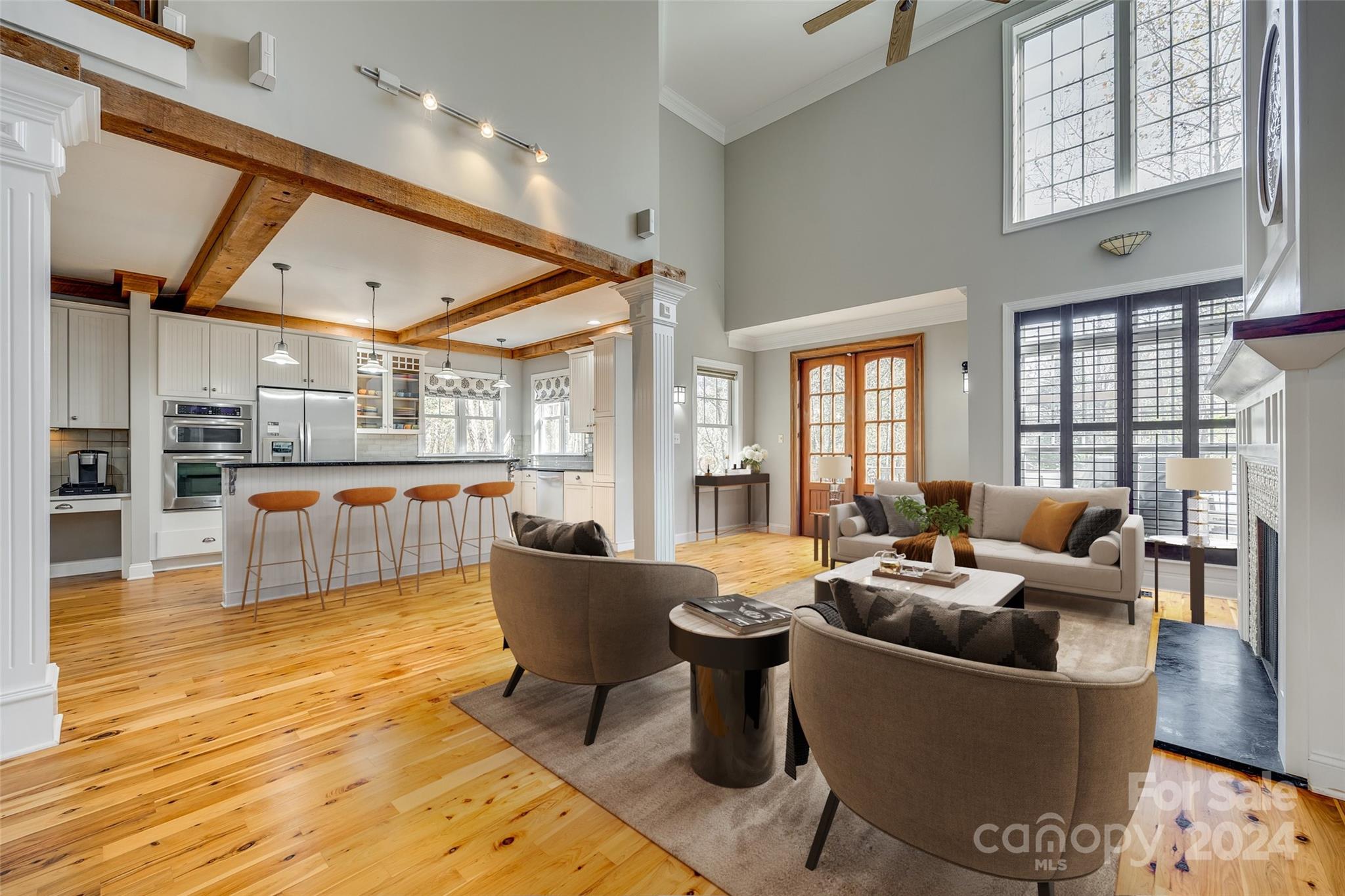 10621 Hanging Moss Trail Charlotte, NC 28227 - Photo 12 of 47 a living room with furniture wooden floor and a large window