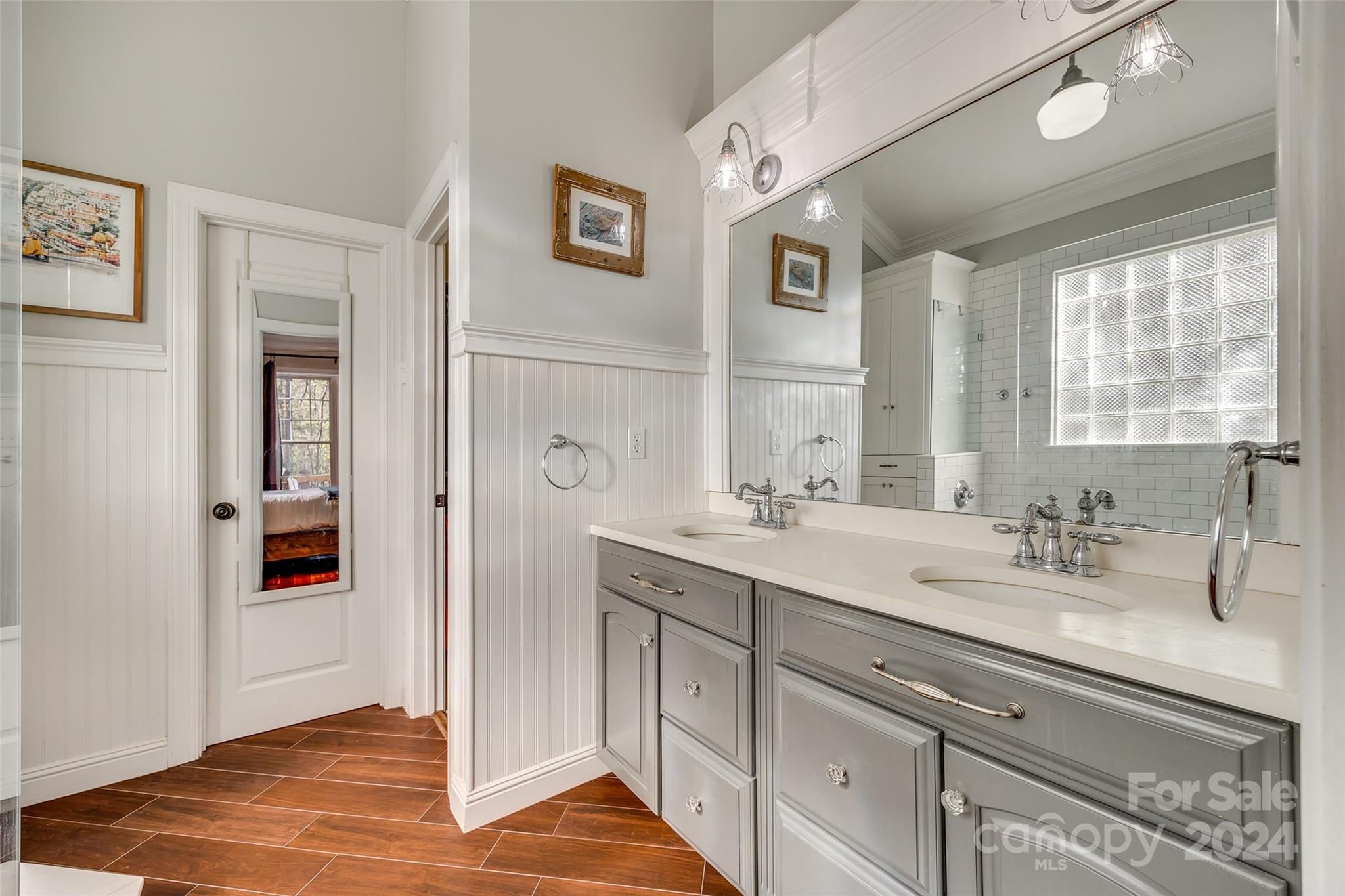 10621 Hanging Moss Trail Charlotte, NC 28227 - Photo 19 of 47 a bathroom with a sink double vanity and a mirror