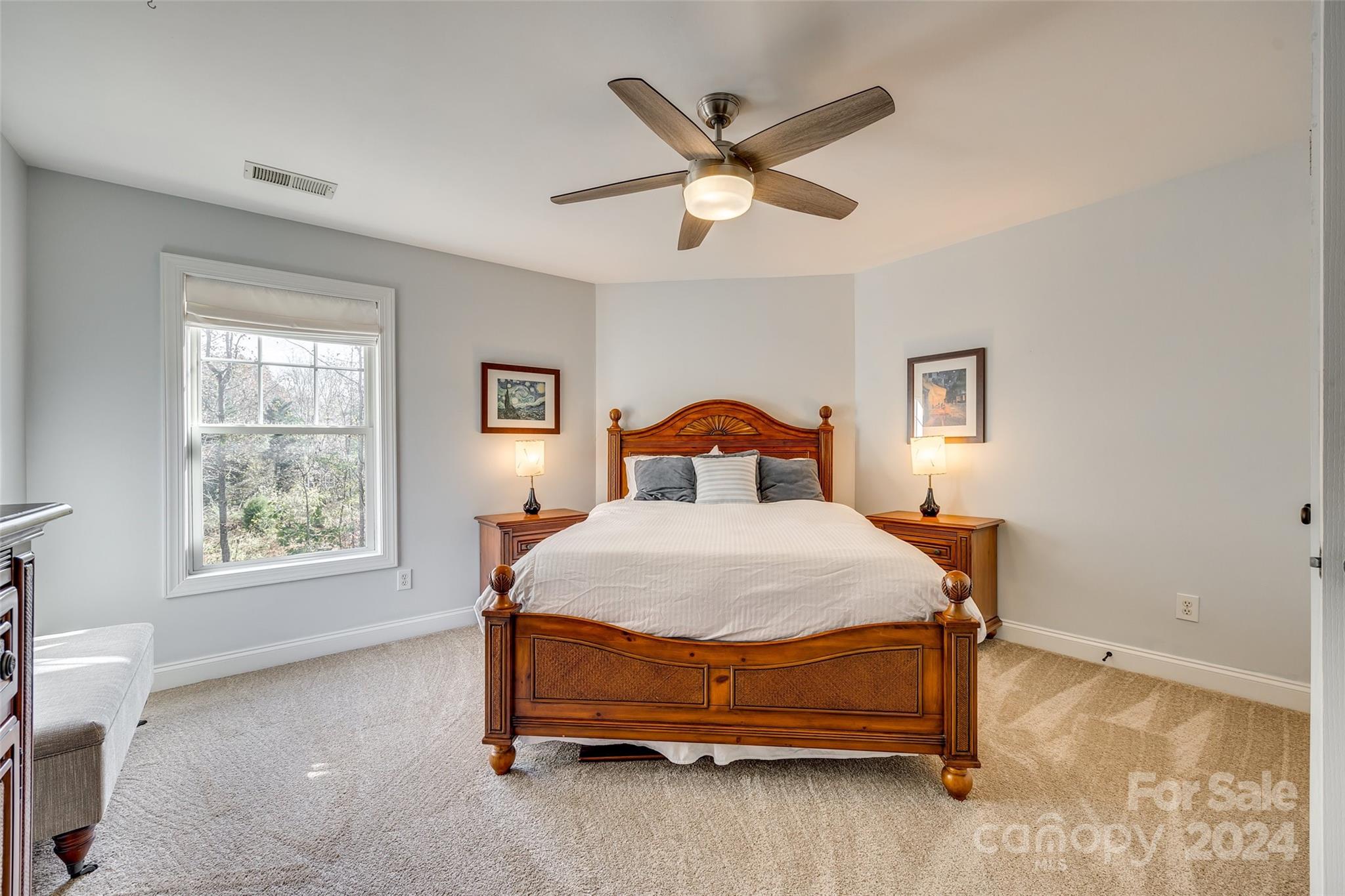 10621 Hanging Moss Trail Charlotte, NC 28227 - Photo 24 of 47 a bedroom with a bed and a window