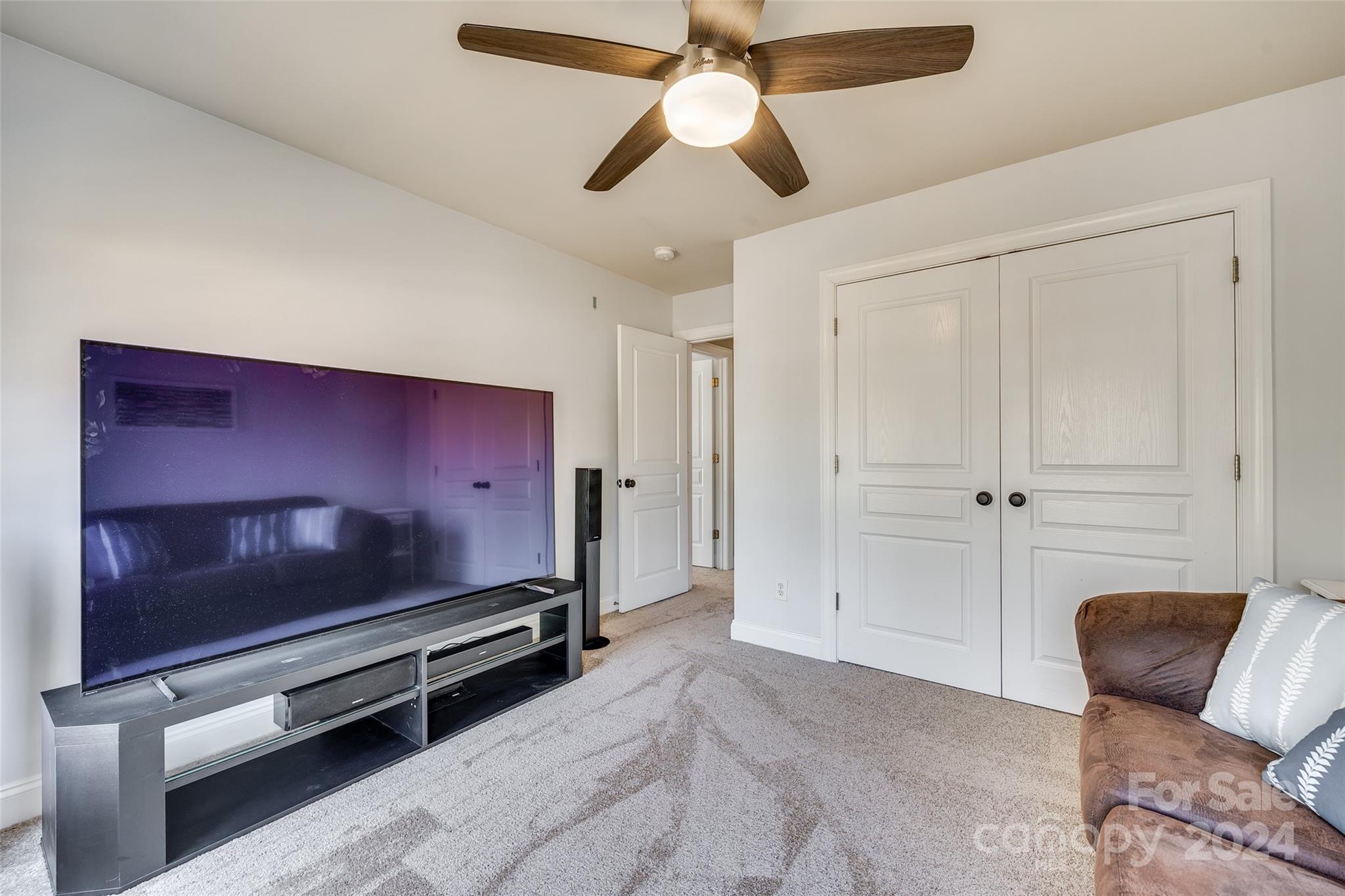 10621 Hanging Moss Trail Charlotte, NC 28227 - Photo 27 of 47 a living room with furniture and a flat screen tv