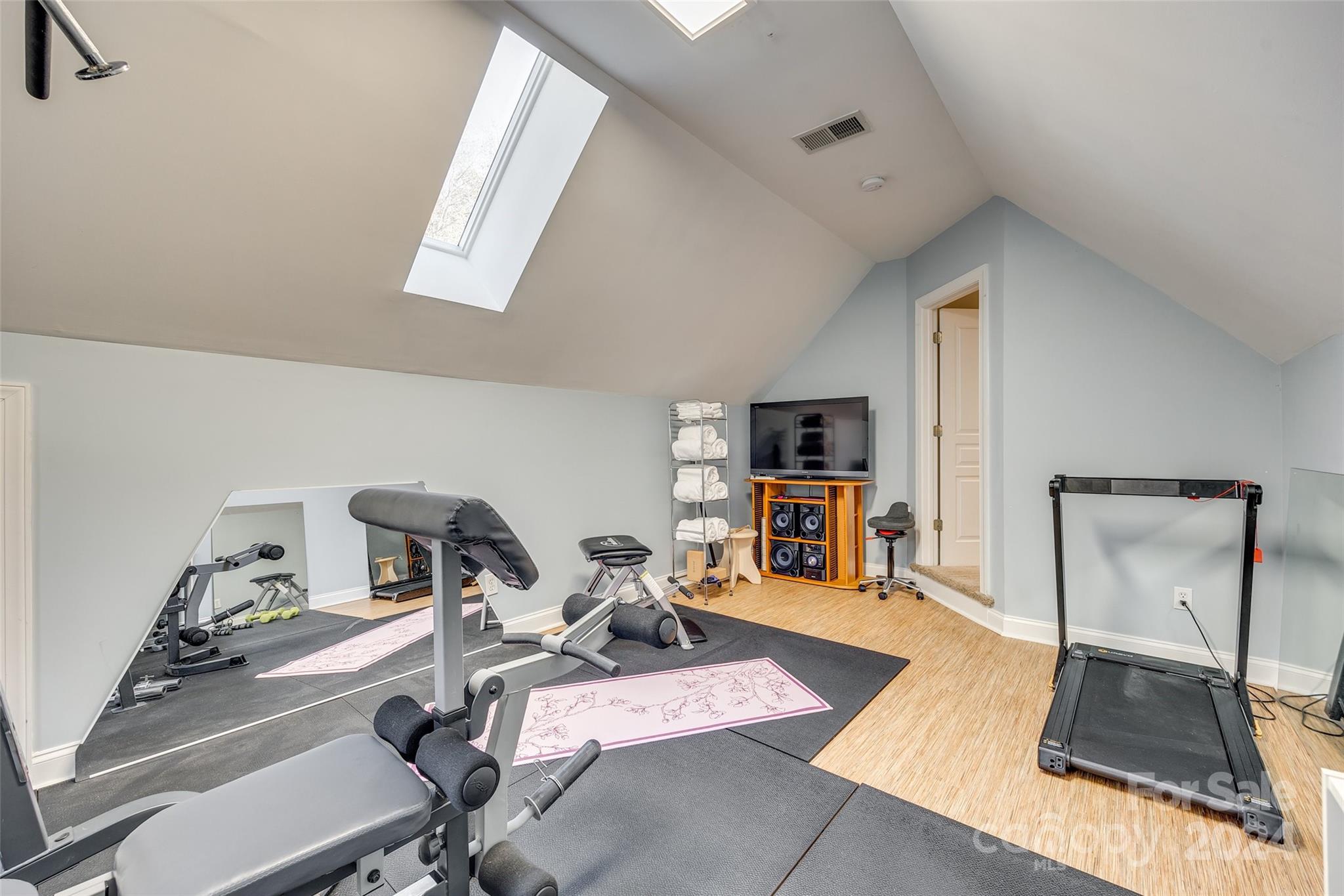 10621 Hanging Moss Trail Charlotte, NC 28227 - Photo 31 of 47 a room with gym equipment and a table