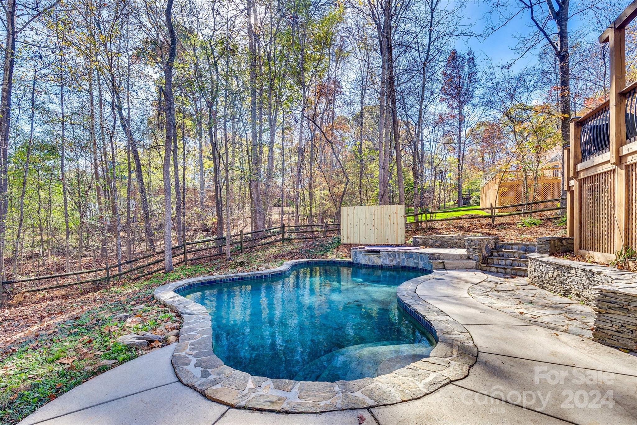 10621 Hanging Moss Trail Charlotte, NC 28227 - Photo 35 of 47 a view of a swimming pool with sitting area