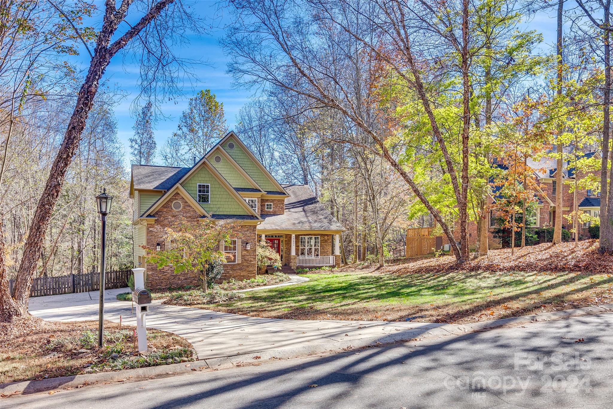 10621 Hanging Moss Trail Charlotte, NC 28227 - Photo 40 of 47 a front view of a house with a yard and garage