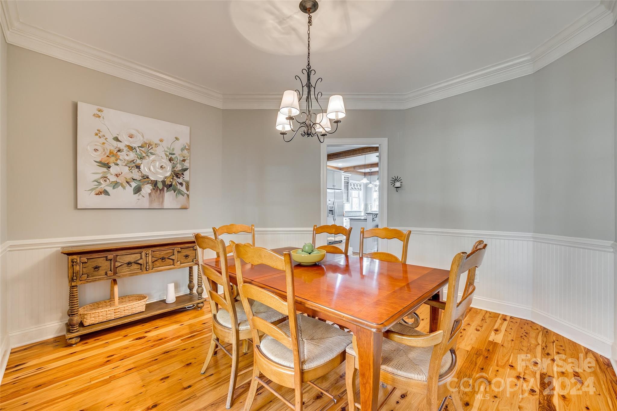 10621 Hanging Moss Trail Charlotte, NC 28227 - Photo 5 of 47 a view of a dining room with furniture and chandelier