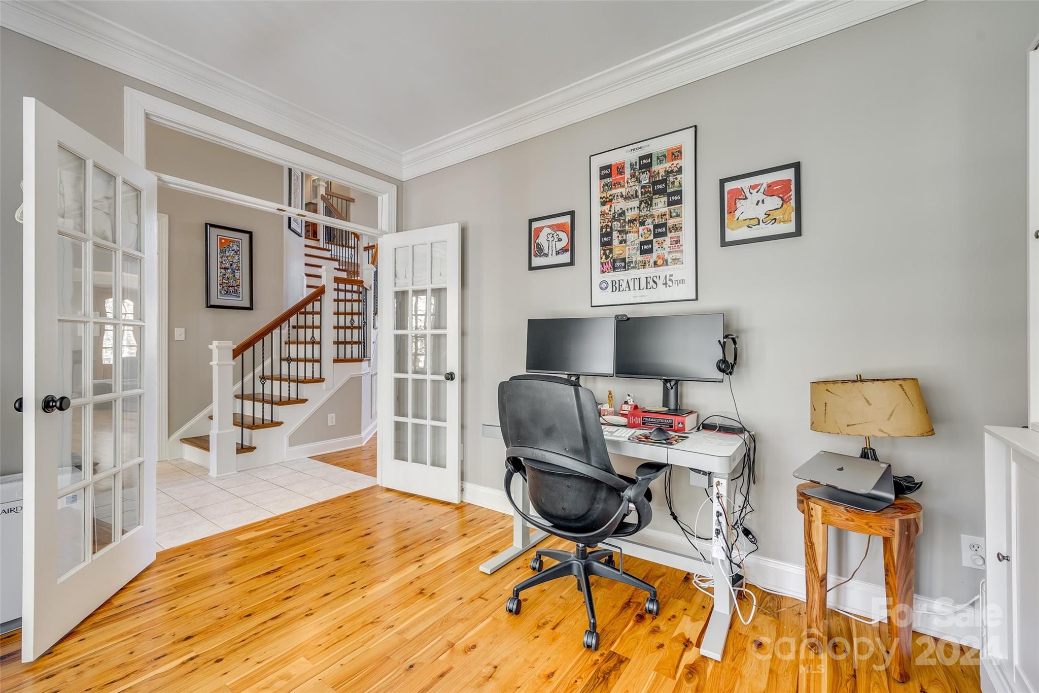 10621 Hanging Moss Trail Charlotte, NC 28227 - Photo 8 of 47 a workspace with furniture and a wooden floor