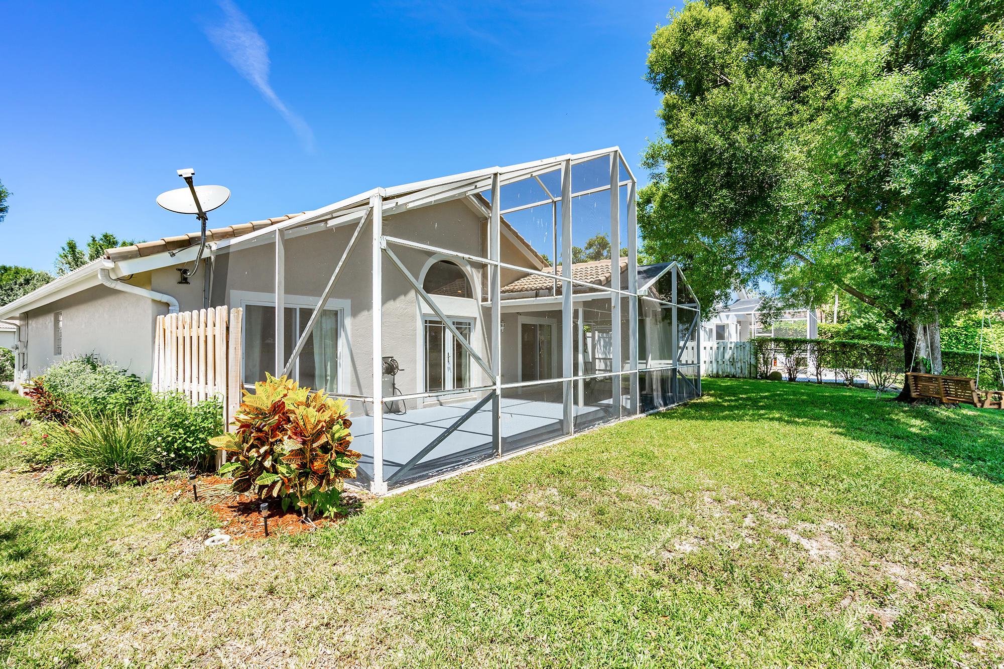 12245 Sunset Point Circle Wellington, FL 33414 - Photo 22 of 27 covered and screened patio