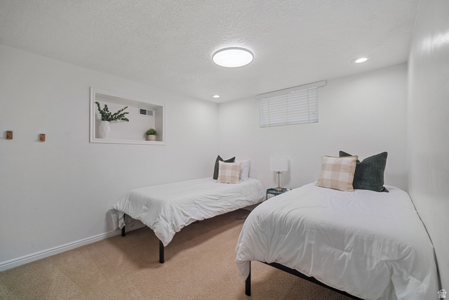 4426 South 3035 East Holladay, UT 84124 - Photo 27 of 49 Carpeted bedroom with a textured ceiling and recessed lighting