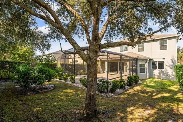 a view of house with yard and green space