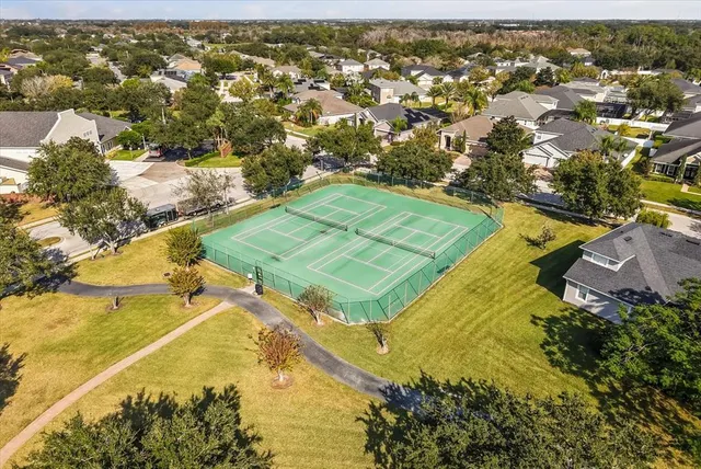 an aerial view of residential houses with outdoor space