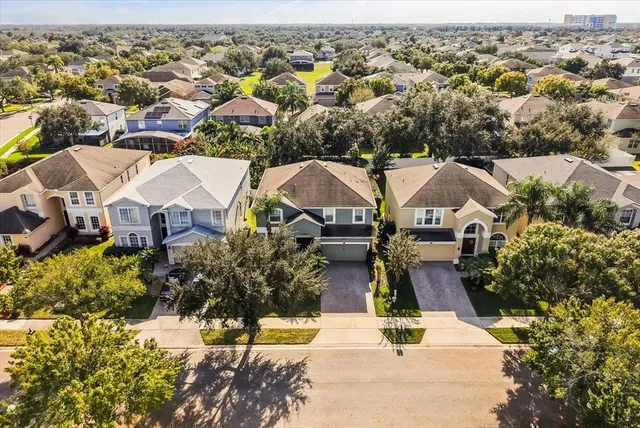 an aerial view of a house with a garden