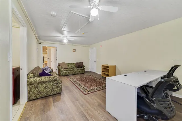 a view of a livingroom with furniture and a chandelier