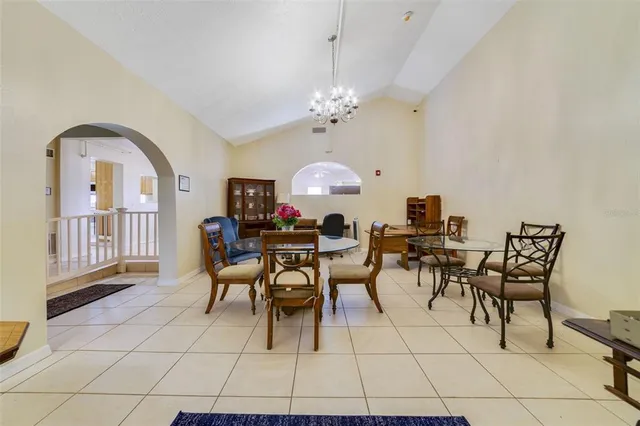 a view of a dining room with furniture and a potted plant