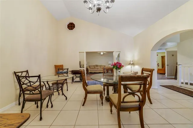 a kitchen with a stove a sink dishwasher a refrigerator and cabinets