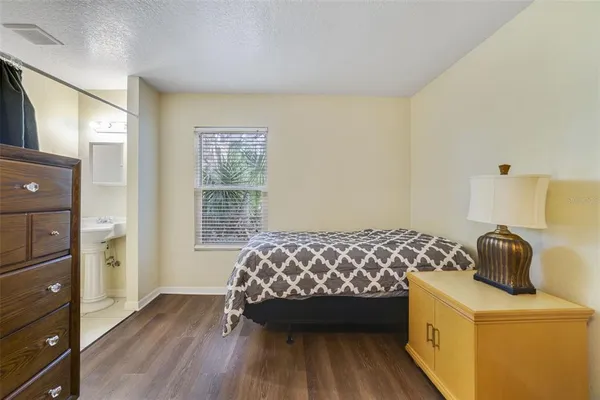 a bedroom with a bed and a dresser