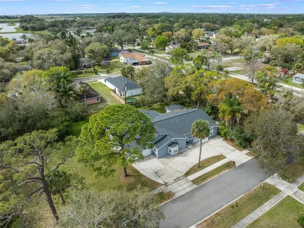 an aerial view of residential house with outdoor space