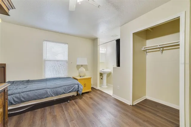 a view of a dining room with furniture and chandelier fan