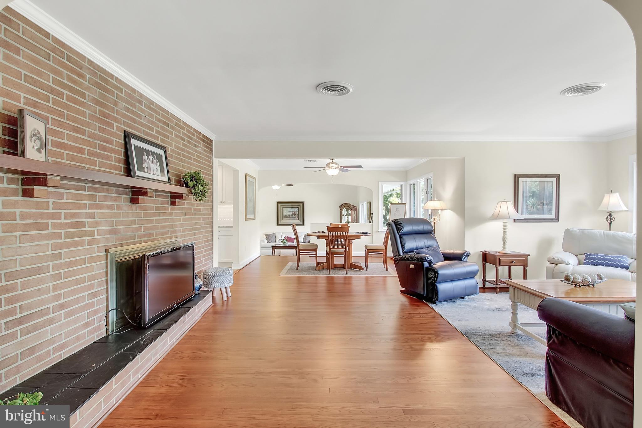 13400 Blythenia Road Phoenix, MD 21131 - Photo 25 of 25 a living room with fireplace furniture and a wooden floor