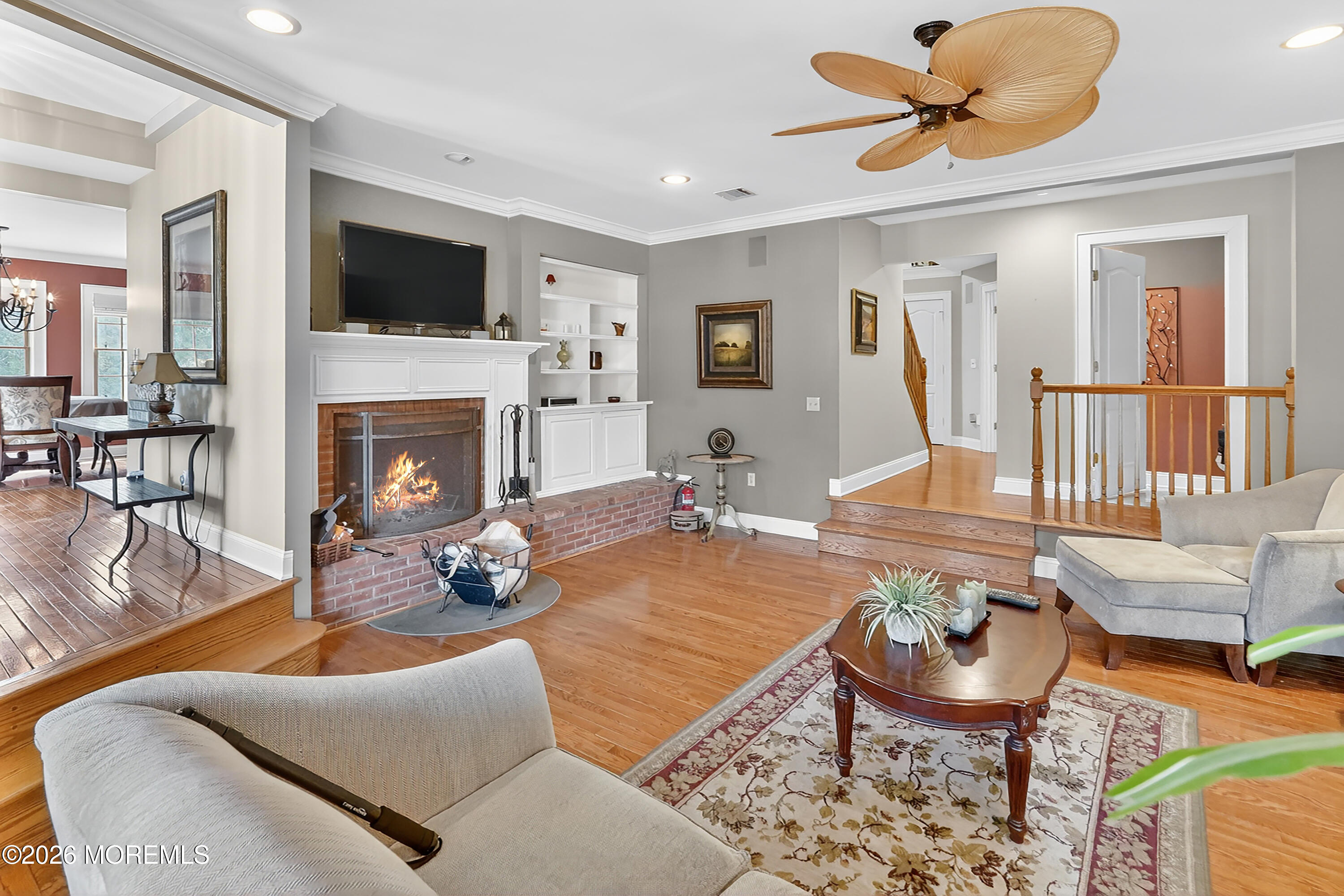 617 Oceanview Road Brielle, NJ 08730 - Photo 11 of 94 a living room with furniture a fireplace and a flat screen tv