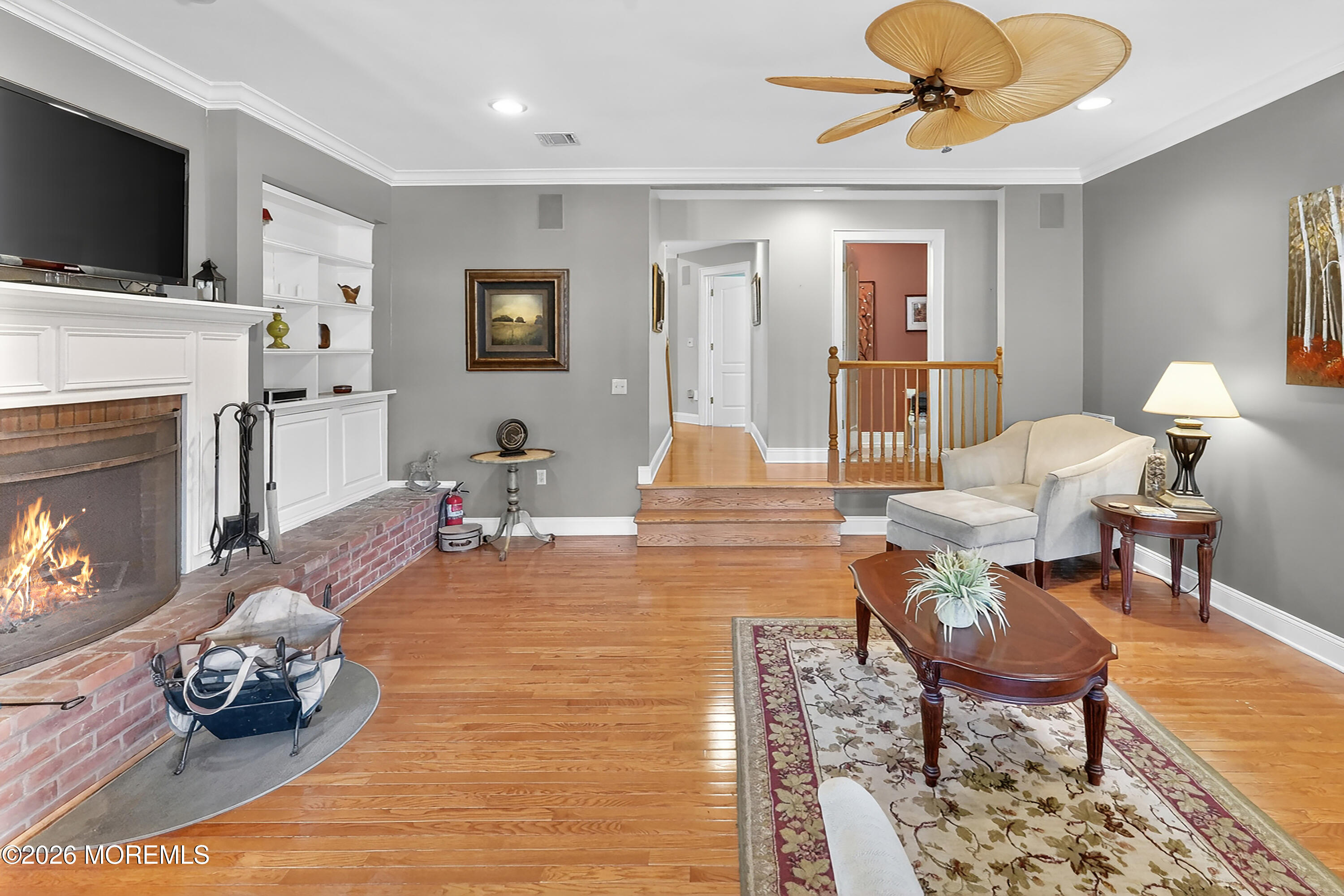 617 Oceanview Road Brielle, NJ 08730 - Photo 12 of 94 a living room with furniture a flat screen tv and a fireplace