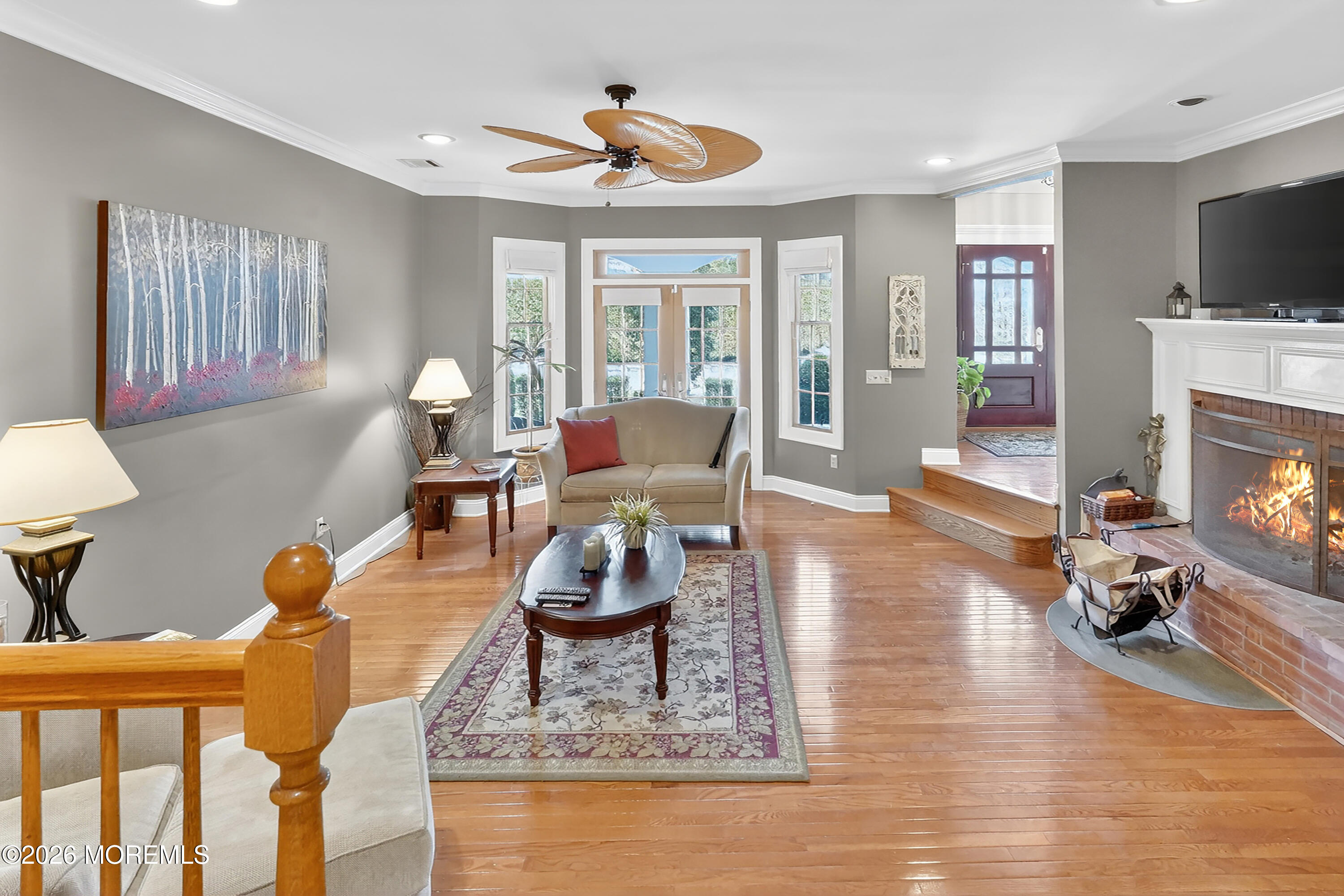 617 Oceanview Road Brielle, NJ 08730 - Photo 13 of 94 a living room with furniture and a fireplace