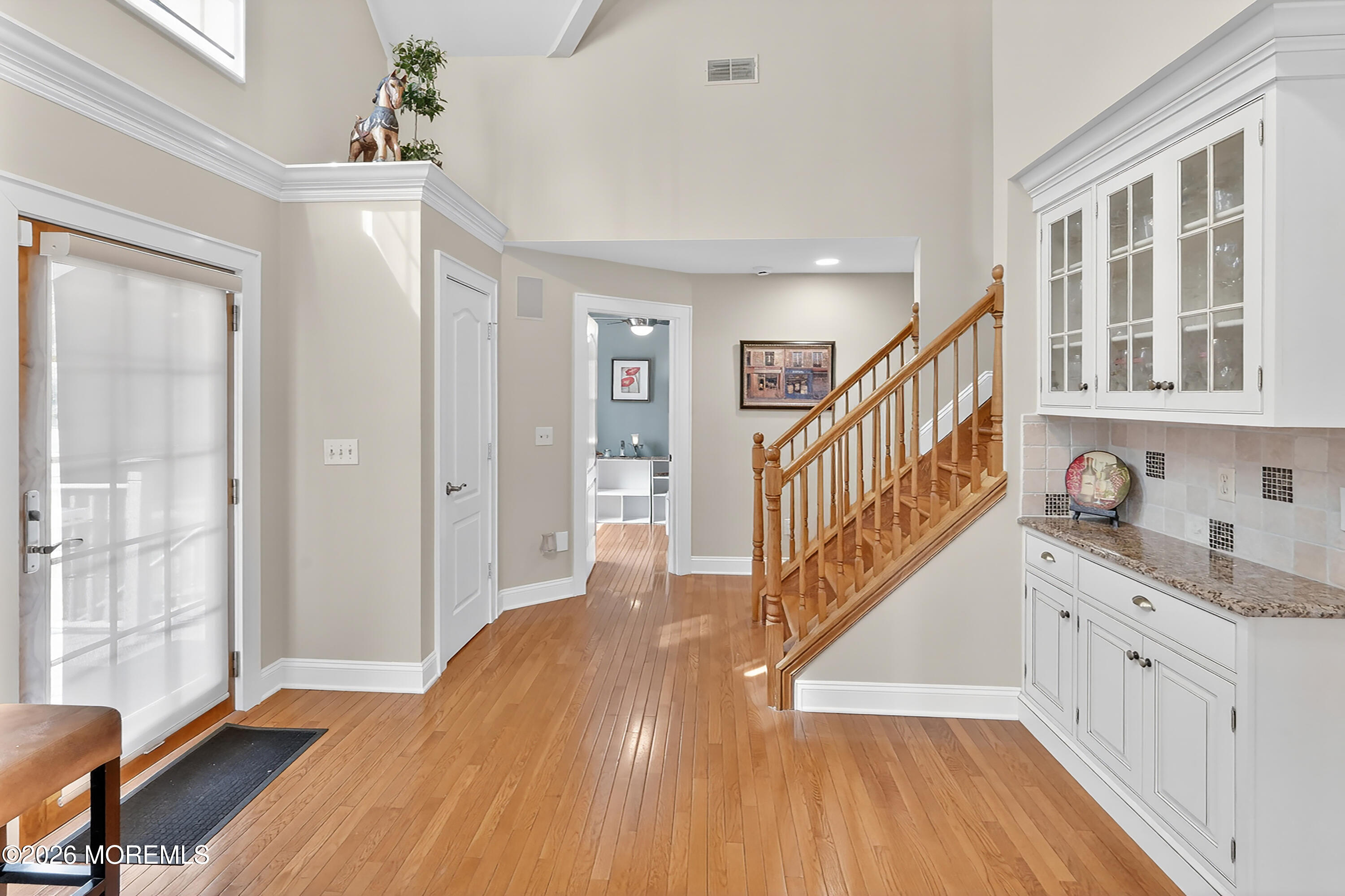 617 Oceanview Road Brielle, NJ 08730 - Photo 27 of 94 a view of a hallway with wooden floor and staircase