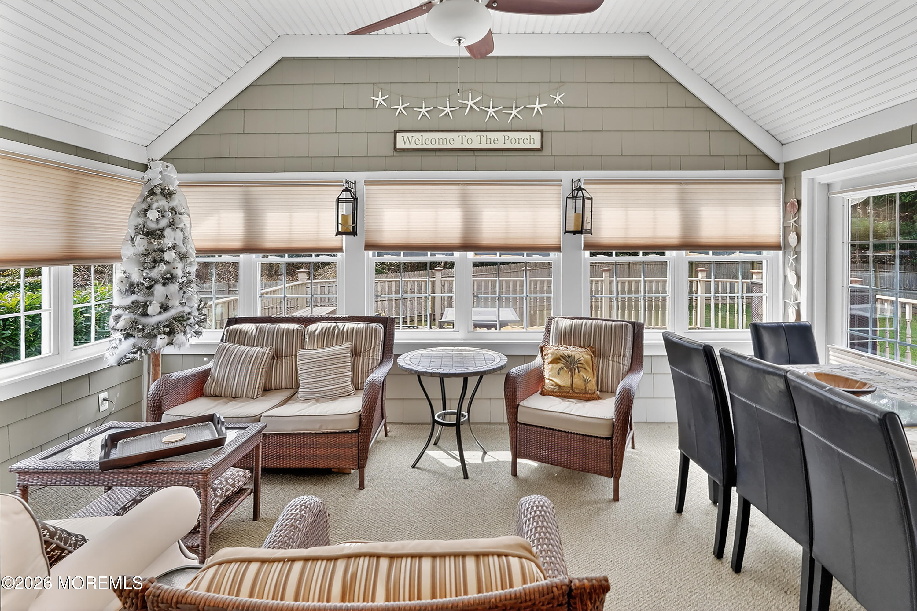 617 Oceanview Road Brielle, NJ 08730 - Photo 29 of 94 a living room with furniture and a floor to ceiling window