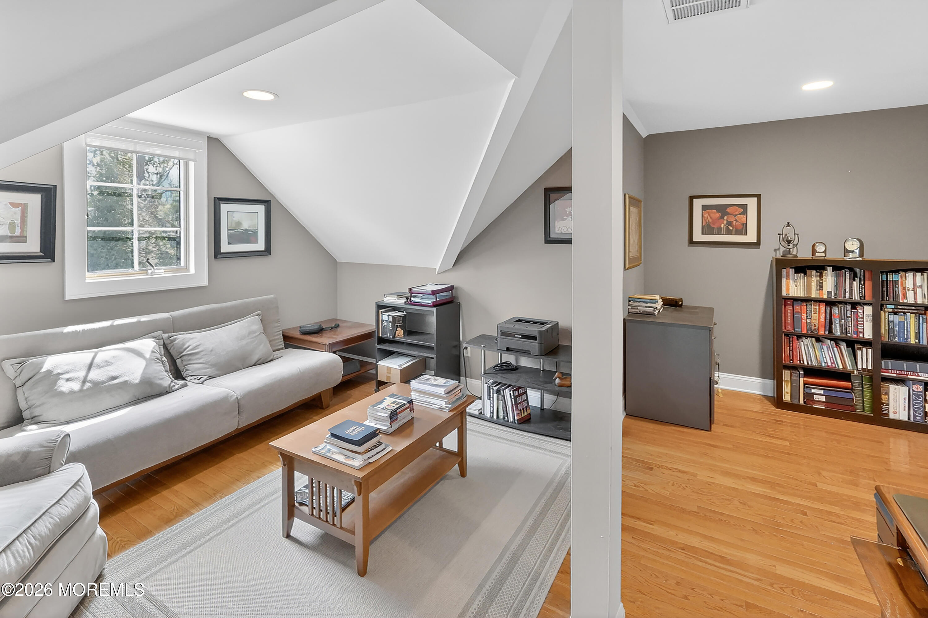 617 Oceanview Road Brielle, NJ 08730 - Photo 32 of 94 a living room with furniture and a book shelf