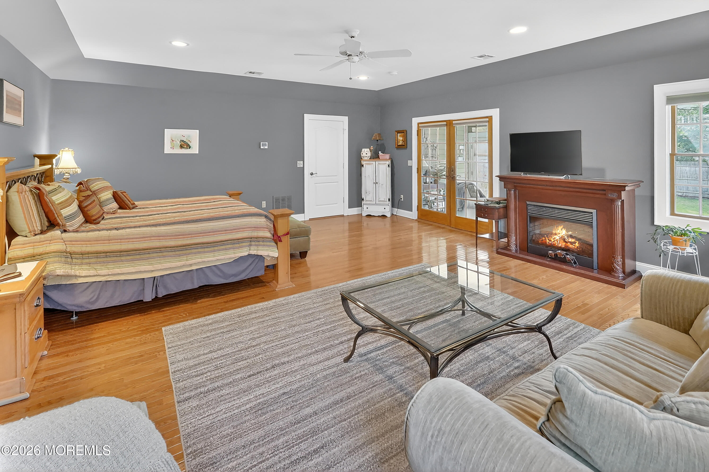 617 Oceanview Road Brielle, NJ 08730 - Photo 39 of 94 a bedroom with furniture and a fireplace