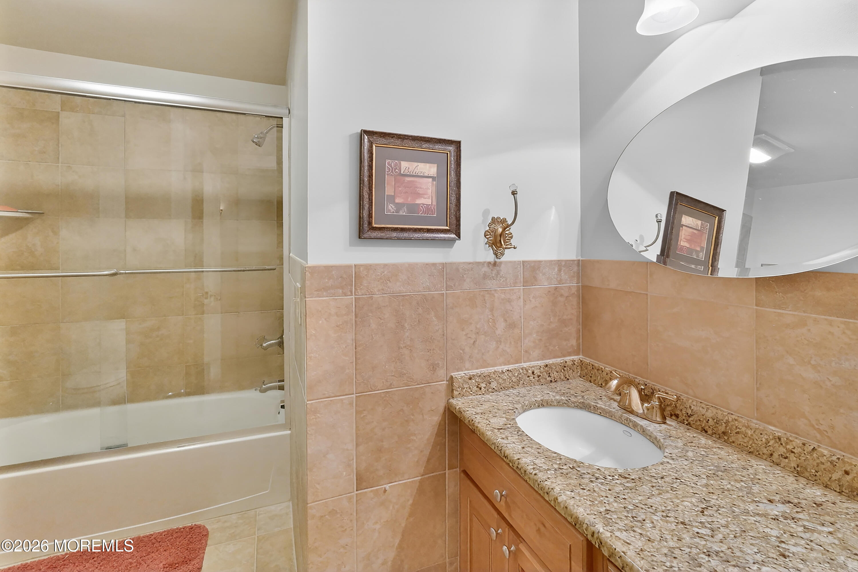 617 Oceanview Road Brielle, NJ 08730 - Photo 51 of 94 a bathroom with a granite countertop sink a mirror and a shower