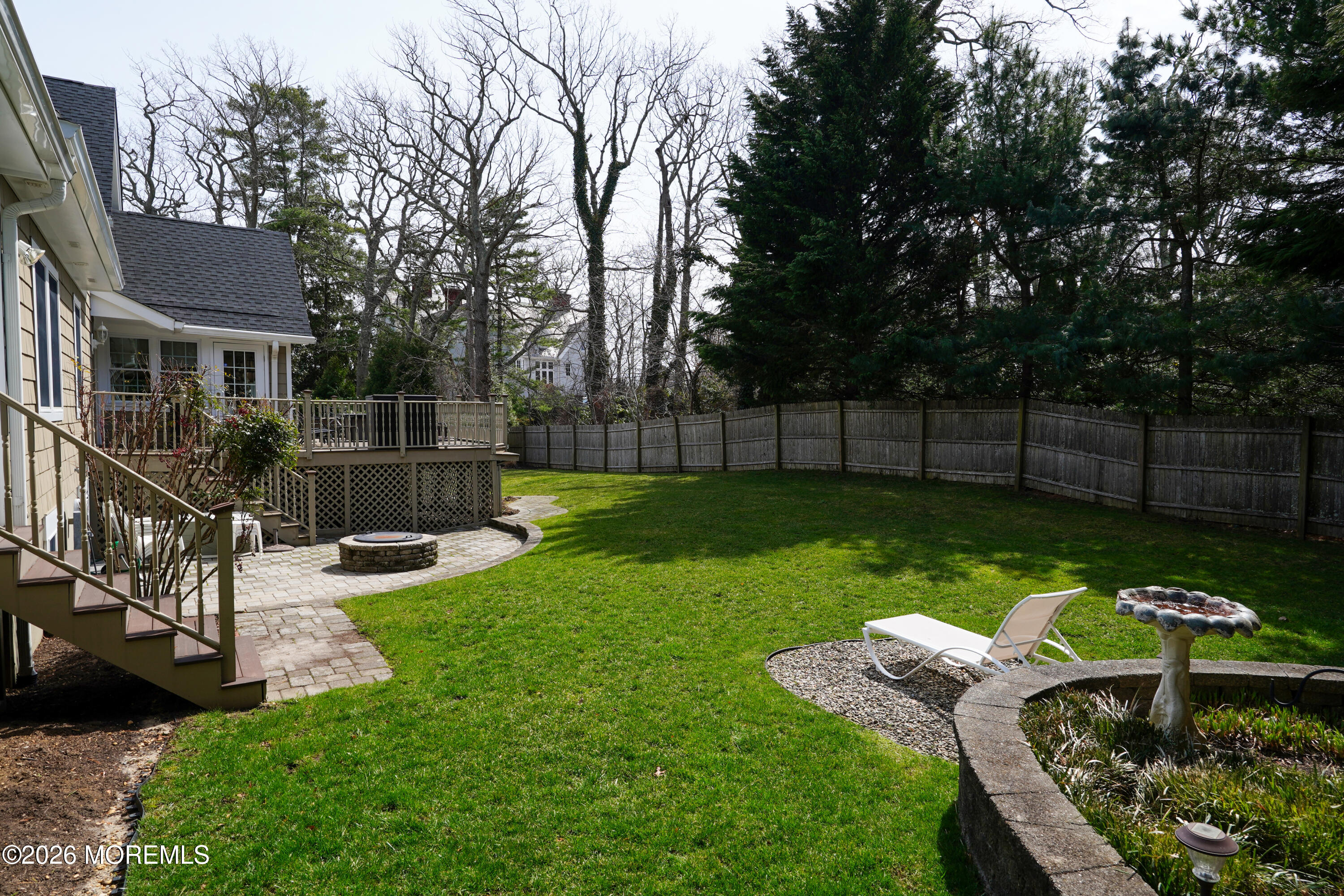 617 Oceanview Road Brielle, NJ 08730 - Photo 80 of 94 a view of a chair and table in the back yard