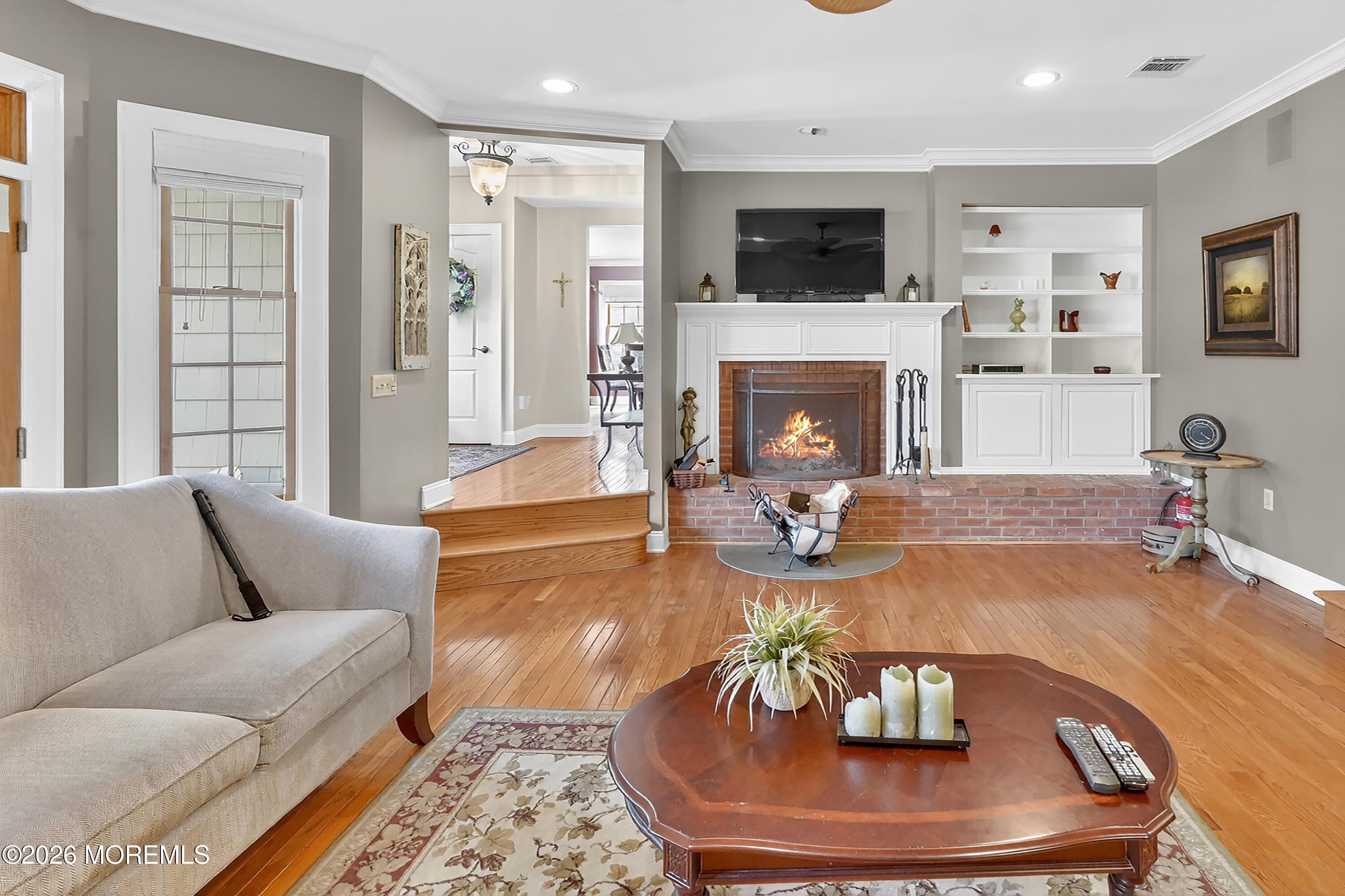 617 Oceanview Road Brielle, NJ 08730 - Photo 10 of 94 a living room with furniture a fireplace and a flat screen tv