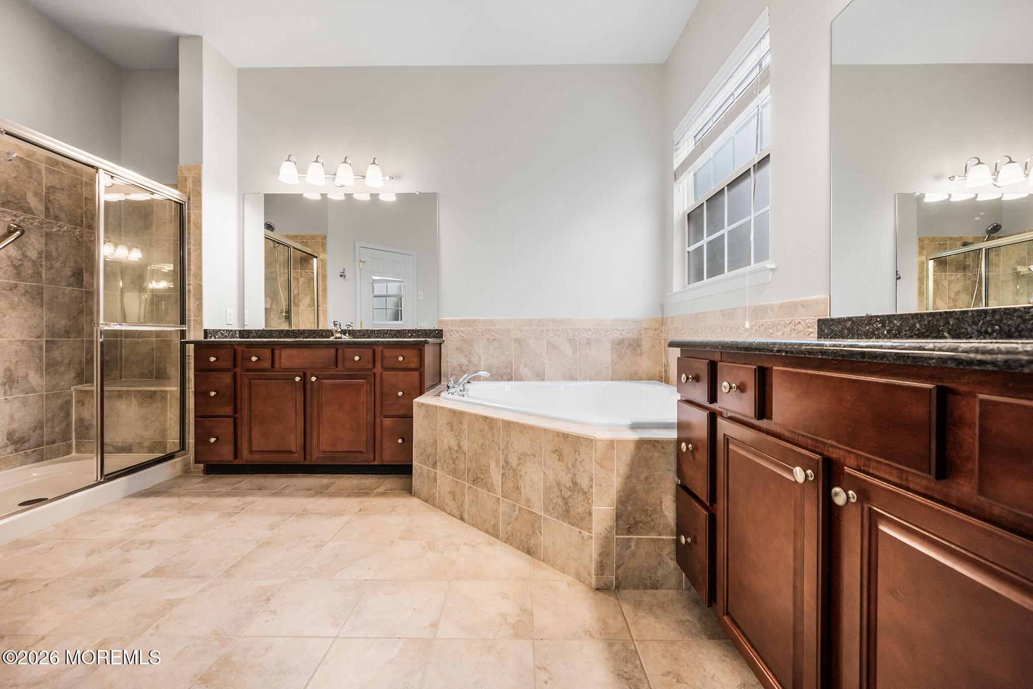 7 Brattleboro Road Jackson, NJ 08527 - Photo 23 of 62 a spacious bathroom with a tub sink and mirror